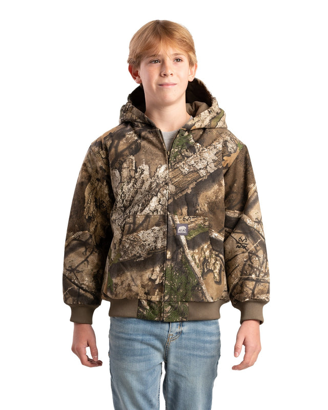 A youth wearing a hooded jacket with a camouflage pattern.