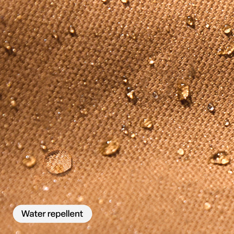 Water beading on the water repellent brown fabric of the Berne Quilted Shirt Jacket
