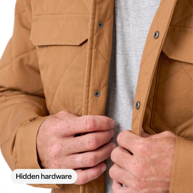 Hidden snap front closure on the Berne Quilted Water Repellent Shirt Jacket in Brown